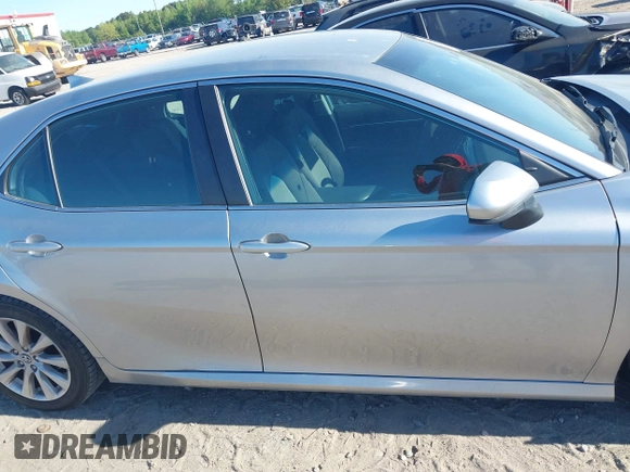2019 Toyota Camry LE z VIN 4T1B11HK7KU756675, wystawiony jako IAAI lot #42063923 z przebiegiem 132 312 mil mil oraz . Historia ofert i sprzedaży dostępna na DreamBid. Obrazek 13.