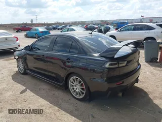 2015 Mitsubishi Lancer Evolution GSR z VIN JA32W8FV2FU020047, wystawiony jako IAAI lot #41890897 z przebiegiem 121 089 mil mil oraz . Historia ofert i sprzedaży dostępna na DreamBid. Obrazek 3.