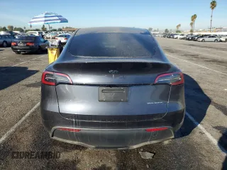 2024 Tesla Model Y Long Range с VIN 7SAYGDEE3RA236473, выставлен на аукционе Copart как лот 77409334 с пробегом 5 822 миль миль и Списание • Salvage title. История ставок и продаж доступна на DreamBid. Изображение 6.