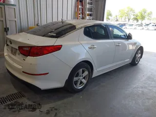 2015 Kia Optima LX z VIN KNAGM4A79F5528215, wystawiony jako IAAI lot #42317163 z przebiegiem 215 395 mil mil oraz . Historia ofert i sprzedaży dostępna na DreamBid. Obrazek 4.
