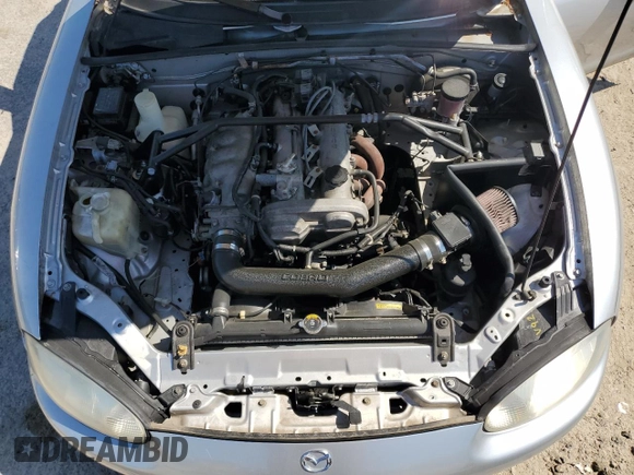 1999 Mazda MX-5 Miata z VIN JM1NB3538X0112611, wystawiony jako Copart lot #54732095 z przebiegiem 173 763 mil mil oraz Szkoda całkowita • Salvage title. Historia ofert i sprzedaży dostępna na DreamBid. Obrazek 11.