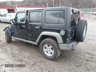 2011 Jeep Wrangler Unlimited Sport with VIN 1J4BA3H17BL552319, listed as a IAAI auction lot 41747031 with 120,751 mi miles. Bid and sale history available at carsss.com. Image 3.