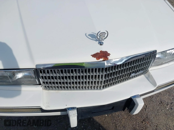 1991 Cadillac Seville z VIN 1G6KS53B9MU820155, wystawiony jako IAAI lot #40035441 z przebiegiem 78 021 mil mil oraz . Historia ofert i sprzedaży dostępna na DreamBid. Obrazek 6.