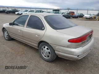 1999 Mercury Mystique GS z VIN 1MEFM6538XK606647, wystawiony jako IAAI lot #41613999 z przebiegiem 90 978 mil mil oraz . Historia ofert i sprzedaży dostępna na DreamBid. Obrazek 3.