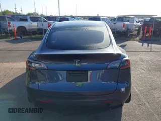 2023 Tesla Model Y Long Range with VIN 7SAYGDEE0PF928836, listed as a IAAI auction lot 41538742 with 9,630 mi miles and . Bid and sale history available at DreamBid. Image 16.