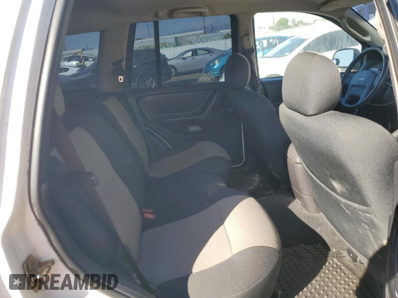 2004 Jeep Grand Cherokee with VIN 1J4GX48JX4C301369, listed as a Copart auction lot 77803094 with 179,404 mi miles and Clean title. Bid and sale history available at DreamBid. Image 11.