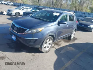 2012 Kia Sportage LX with VIN KNDPBCA28C7273676, listed as a IAAI auction lot 42034764 with 121,527 mi miles and . Bid and sale history available at DreamBid. Image 2.