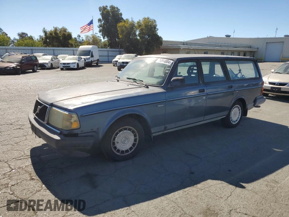 1993 Volvo 240 with VIN YV1AW8311P1955233, listed as a Copart auction lot 76514004 with 216,723 mi miles and Salvage title. Bid and sale history available at DreamBid. Image 1.