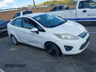 2012 Ford Fiesta SE with VIN 3FADP4BJ7CM102932, listed as a IAAI auction lot 41760394 with 70,394 mi miles and . Bid and sale history available at carsss.com. Image 1.