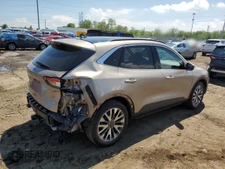 2020 Ford Escape Titanium with VIN 1FMCU9J90LUA49890, listed as a Copart auction lot 57228065 with 24,283 mi miles and Salvage title. Bid and sale history available at DreamBid. Image 3.