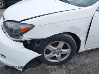 2002 Toyota Camry XLE z VIN 4T1BF30K72U500934, wystawiony jako IAAI lot #42312967 z przebiegiem 169 569 mil mil oraz . Historia ofert i sprzedaży dostępna na DreamBid. Obrazek 6.