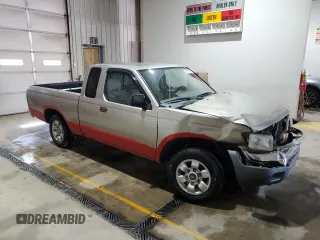 2000 Nissan Frontier XE with VIN 1N6DD26S8YC337811, listed as a Copart auction lot 54775915 with 129,427 mi miles and Salvage title. Bid and sale history available at DreamBid. Image 4.