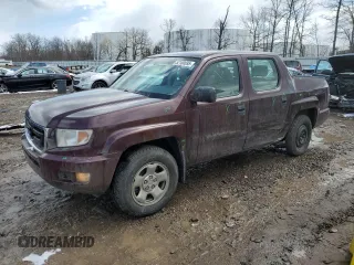 2010 Honda Ridgeline RT with VIN 5FPYK1F23AB008602, listed as a Copart auction lot 52180695 with 144,878 mi miles and Salvage Title. Bid and sale history available at carsss.com. Image 1.