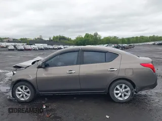 2012 Nissan Versa SV with VIN 3N1CN7AP3CL860116, listed as a IAAI auction lot 42329920 with 105,447 mi miles and . Bid and sale history available at DreamBid. Image 14.