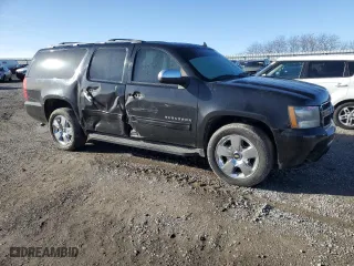 2009 Chevrolet Suburban LT w/2LT with VIN 1GNFC26069R297182, listed as a Copart auction lot 84915294 with 221,946 mi miles and Salvage Title. Bid and sale history available at carsss.com. Image 4.