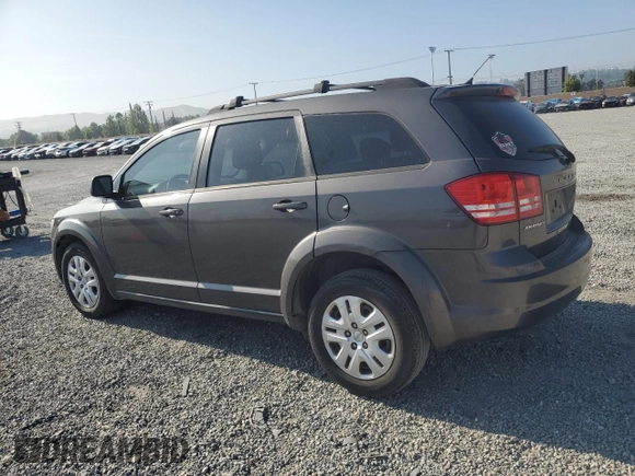 2014 Dodge Journey American Value with VIN 3C4PDCABXET277897, listed as a Copart auction lot 60566735 with 113,343 mi miles and Salvage title. Bid and sale history available at DreamBid. Image 2.