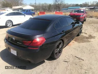2014 BMW 6 Series 640i z VIN WBA6A0C57EDZ04682, wystawiony jako IAAI lot #41891362 z przebiegiem 140 478 mil mil oraz . Historia ofert i sprzedaży dostępna na DreamBid. Obrazek 4.