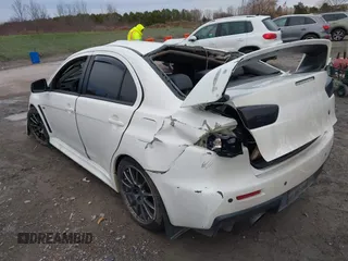 2014 Mitsubishi Lancer Evolution GSR with VIN JA32W8FV5EU012572, listed as a IAAI auction lot 40871463 with 89,529 mi miles. Bid and sale history available at carsss.com. Image 3.