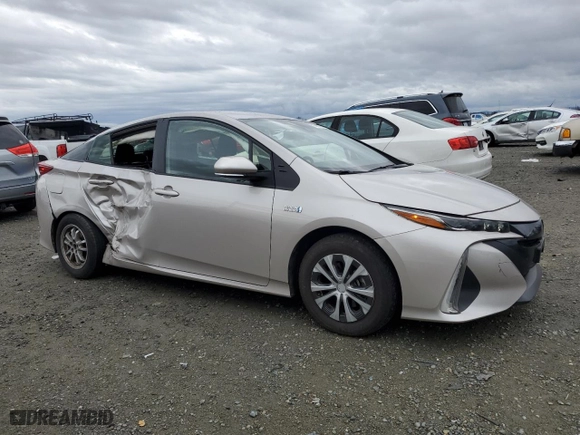 2021 Toyota Prius Prime LE with VIN JTDKAMFP7M3175920, listed as a Copart auction lot 43618755 with 105,228 mi miles and Salvage Title. Bid and sale history available at carsss.com. Image 4.