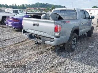 2021 Toyota Tacoma SR with VIN 5TFCZ5AN7MX255512, listed as a IAAI auction lot 42497907 with 50,563 mi miles and . Bid and sale history available at DreamBid. Image 4.