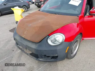 2012 Volkswagen Beetle 2.5L PZEV with VIN 3VWJP7AT0CM641164, listed as a IAAI auction lot 40698387 with 113,200 mi miles. Bid and sale history available at carsss.com. Image 6.