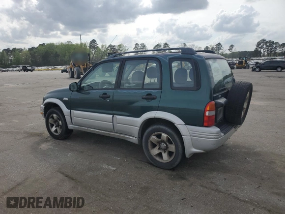 1999 Suzuki Grand Vitara JLX z VIN JS3TD62V0X4124366, wystawiony jako Copart lot #50885055 z przebiegiem 204 168 mil mil oraz Szkoda całkowita • Salvage title. Historia ofert i sprzedaży dostępna na DreamBid. Obrazek 2.