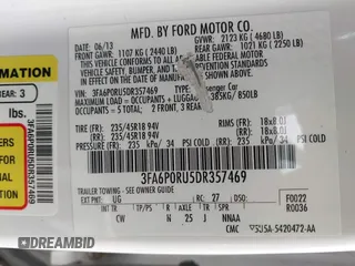 2013 Ford Fusion Titanium Hybrid with VIN 3FA6P0RU5DR357469, listed as a IAAI auction lot 41969315 with 215,732 mi miles. Bid and sale history available at carsss.com. Image 9.