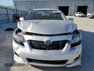 2010 Toyota Corolla z VIN 1NXBU4EE2AZ281538, wystawiony jako Copart lot #54864765 z przebiegiem 157 326 mil mil oraz Szkoda całkowita • Salvage title. Historia ofert i sprzedaży dostępna na DreamBid. Obrazek 5.