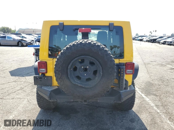2015 Jeep Wrangler Rubicon Hard Rock with VIN 1C4BJWCG6FL568665, listed as a Copart auction lot 60282155 with 107,773 mi miles and Salvage title. Bid and sale history available at DreamBid. Image 6.
