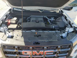2023 GMC Canyon 4WD AT4X with VIN 1GTP6EEK6P1235222, listed as a Copart auction lot 75664684 with 9,736 mi miles and Salvage Title. Bid and sale history available at carsss.com. Image 11.