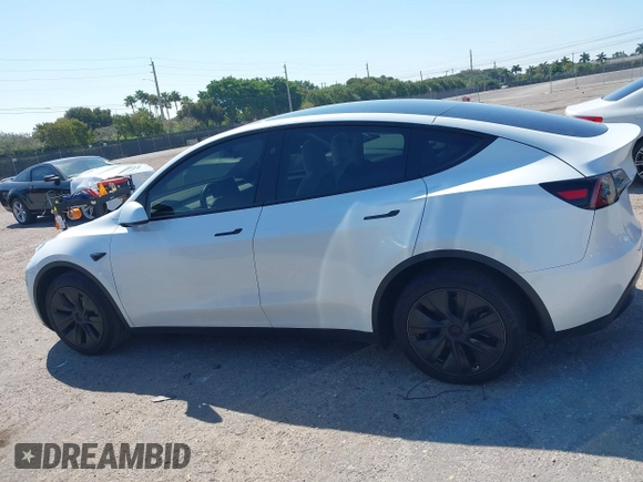 2024 Tesla Model Y with VIN 7SAYGDED9RF161420, listed as a IAAI auction lot 41892788 with 12,353 mi miles and . Bid and sale history available at DreamBid. Image 14.
