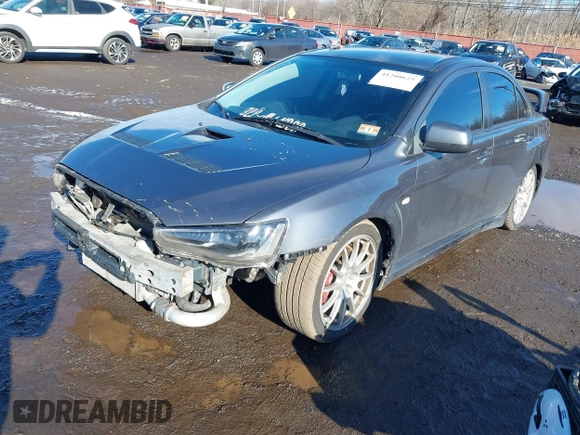 2008 Mitsubishi Lancer Evolution GSR with VIN JA3AW86V18U044077, listed as a IAAI auction lot 41208625 with 157,788 mi miles. Bid and sale history available at carsss.com. Image 2.