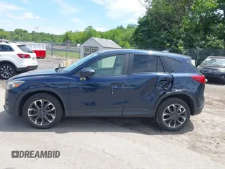 2016 Mazda CX-5 Grand Touring z VIN JM3KE4DY1G0817562, wystawiony jako IAAI lot #42289929 z przebiegiem 135 476 mil mil oraz . Historia ofert i sprzedaży dostępna na DreamBid. Obrazek 6.