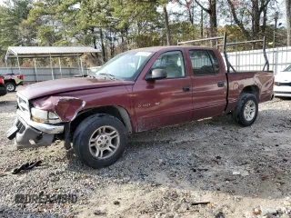 2001 Dodge Dakota z VIN 1B7HL2AX21S313896, wystawiony jako Copart lot #82873164 z przebiegiem 205 821 mil mil oraz Szkoda całkowita • Salvage title. Historia ofert i sprzedaży dostępna na DreamBid. Obrazek 1.