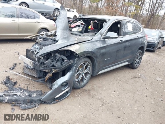 2017 BMW X1 sDrive28i with VIN WBXHU7C39H5H36722, listed as a IAAI auction lot 41724022 with 33,412 mi miles. Bid and sale history available at carsss.com. Image 2.