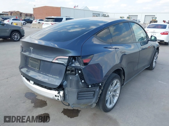 2023 Tesla Model Y Long Range with VIN 7SAYGDEEXPA078629, listed as a IAAI auction lot 42046354 with 27,245 mi miles and . Bid and sale history available at DreamBid. Image 4.