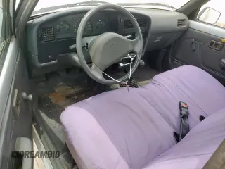 1992 Toyota Pickup z VIN 4TARN81A9NZ011107, wystawiony jako Copart lot #59125725 z przebiegiem 190 647 mil mil oraz Szkoda całkowita • Salvage title. Historia ofert i sprzedaży dostępna na DreamBid. Obrazek 8.