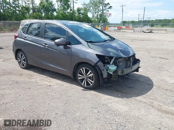 2019 Honda Fit EX z VIN 3HGGK5H89KM736677, wystawiony jako IAAI lot #42443401 z przebiegiem 58 559 mil mil oraz . Historia ofert i sprzedaży dostępna na DreamBid. Obrazek 1.