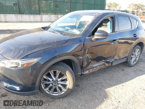 2020 Mazda CX-5 Grand Touring with VIN JM3KFBDM4L0779284, listed as a IAAI auction lot 42060936 with 9,227 mi miles. Bid and sale history available at carsss.com. Image 6.