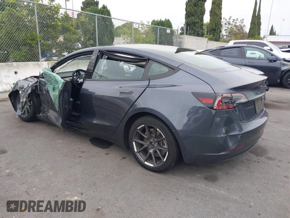 2023 Tesla Model 3 with VIN 5YJ3E1EA4PF705949, listed as a IAAI auction lot 42336682 with 88,056 mi miles and . Bid and sale history available at DreamBid. Image 3.