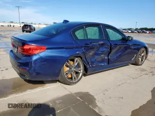 2020 BMW 5 Series M550i xDrive with VIN WBAJS7C09LCE06865, listed as a Copart auction lot 60140955 with Not provided miles and Salvage title. Bid and sale history available at DreamBid. Image 3.
