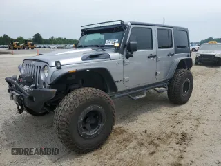 2013 Jeep Wrangler Unlimited Rubicon with VIN 1C4BJWFG5DL661282, listed as a Copart auction lot 57471035 with 128,400 mi miles and Salvage title. Bid and sale history available at DreamBid. Image 1.