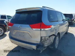 2011 Toyota Sienna XLE AAS with VIN 5TDYK3DCXBS172586, listed as a IAAI auction lot 41835992 with 203,599 mi miles. Bid and sale history available at carsss.com. Image 4.