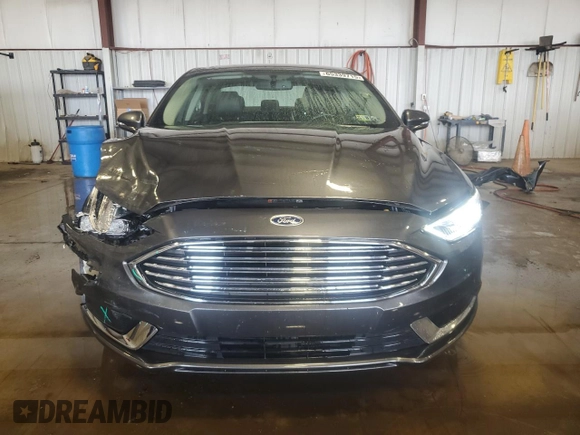 2018 Ford Fusion SE with VIN 3FA6P0PUXJR123360, listed as a Copart auction lot 65339715 with 113,635 mi miles and Salvage title. Bid and sale history available at DreamBid. Image 5.