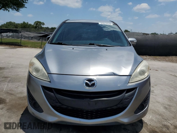 2014 Mazda 5 Sport z VIN JM1CW2BL0E0170901, wystawiony jako Copart lot #57829555 z przebiegiem 102 210 mil mil oraz Szkoda całkowita • Salvage title. Historia ofert i sprzedaży dostępna na DreamBid. Obrazek 5.