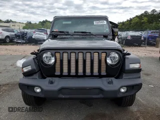 2023 Jeep Wrangler Sport S with VIN 1C4HJXDN6PW618252, listed as a Copart auction lot 55939455 with 69,681 mi miles and Salvage title. Bid and sale history available at DreamBid. Image 5.
