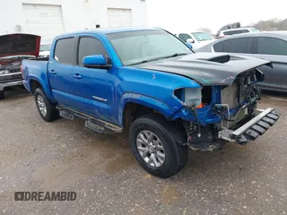 2016 Toyota Tacoma SR with VIN 5TFCZ5AN4GX013233, listed as a IAAI auction lot 41394610 with 142,099 mi miles. Bid and sale history available at carsss.com. Image 1.