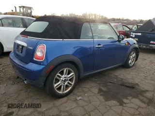 2014 MINI Convertible with VIN WMWZN3C53ET861225, listed as a Copart auction lot 87791665 with 104,151 mi miles and Salvage title. Bid and sale history available at DreamBid. Image 3.