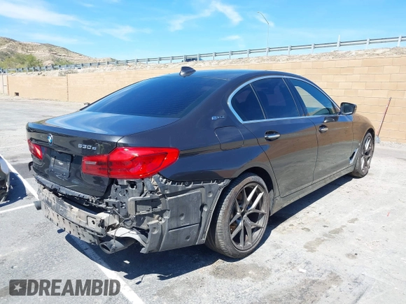 2018 BMW 5 Series 530e xDrive with VIN WBAJB1C58JB085443, listed as a IAAI auction lot 41856298 with 93,110 mi miles and . Bid and sale history available at DreamBid. Image 4.