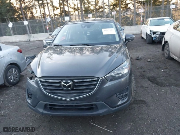 2016 Mazda CX-5 Grand Touring with VIN JM3KE4DY3G0817899, listed as a IAAI auction lot 41287459 with NaN miles. Bid and sale history available at carsss.com. Image 13.